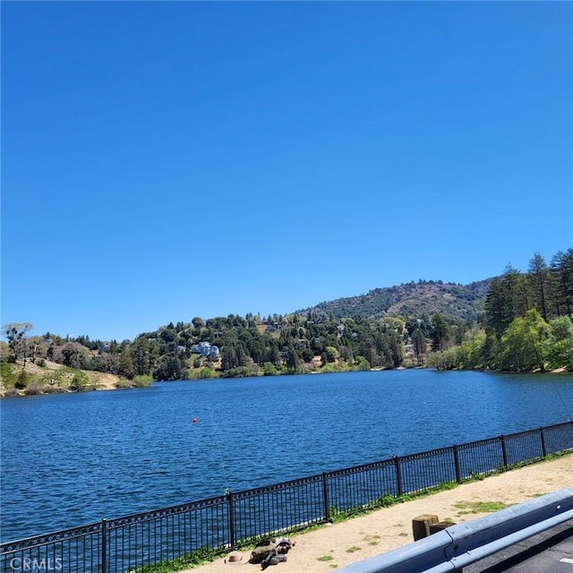 23747 Bowl Rd, Crestline, CA 92325 - water view featuring fence and a forest view
