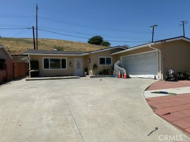 18016 Los Palacios, Rowland Heights, CA 91748 - ranch-style home featuring an attached garage, stucco siding, and concrete driveway