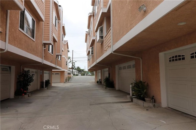 view of road featuring concrete driveway