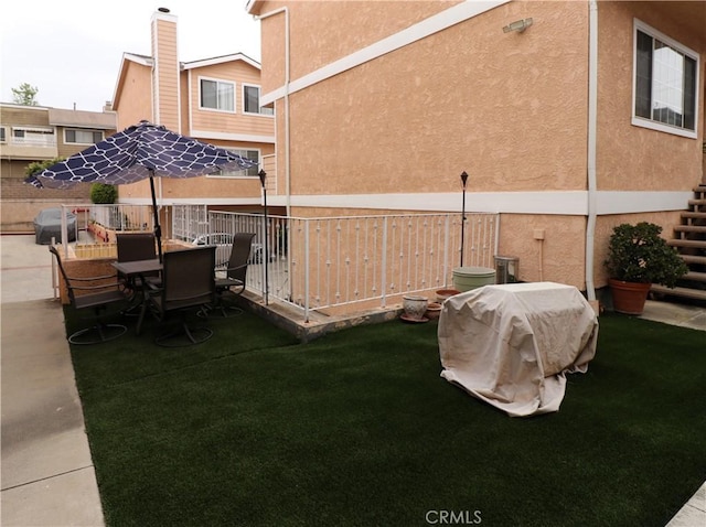 view of yard featuring outdoor dining area