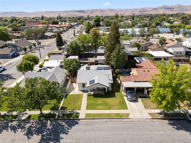 drone / aerial view featuring a mountain view and a residential view