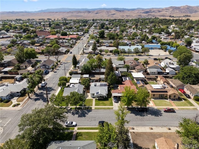 drone / aerial view featuring a residential view and a mountain view