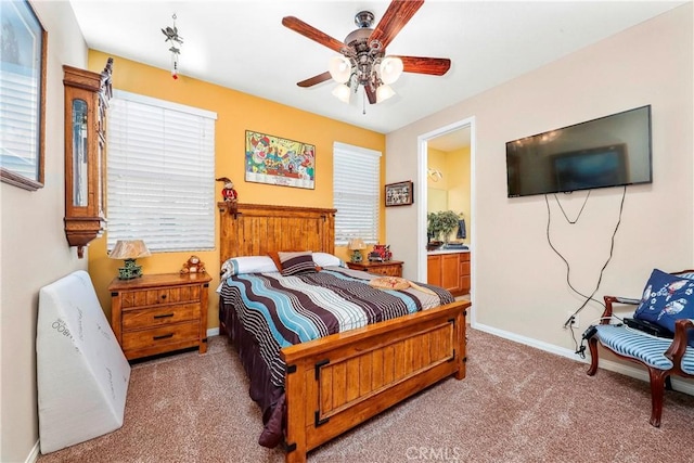 3565 Louer Dr, Lancaster, CA 93536 - bedroom with baseboards, a ceiling fan, carpet floors, and connected bathroom