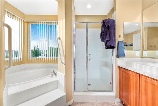 3565 Louer Dr, Lancaster, CA 93536 - full bathroom with vanity, plenty of natural light, a bath, and a stall shower