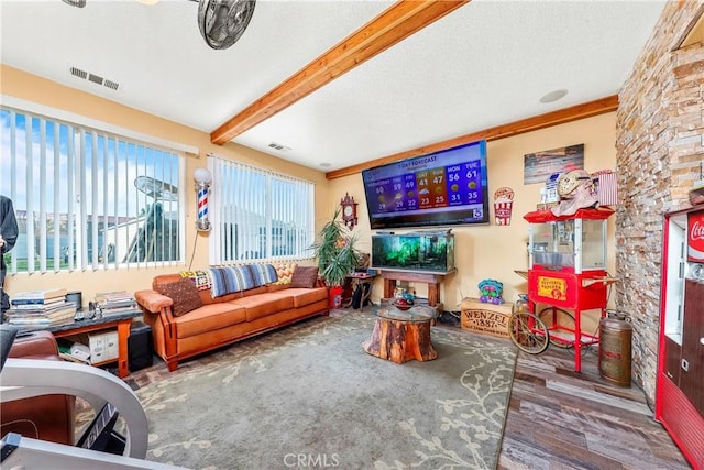 3565 Louer Dr, Lancaster, CA 93536 - living room with beam ceiling, wood finished floors, and visible vents