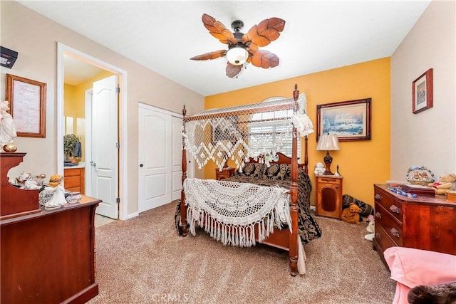 3565 Louer Dr, Lancaster, CA 93536 - bedroom featuring a closet, connected bathroom, a ceiling fan, and carpet floors