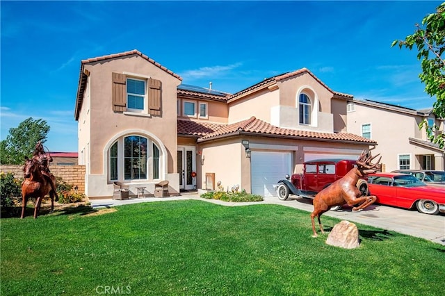3565 Louer Dr, Lancaster, CA 93536 - mediterranean / spanish house with roof mounted solar panels, a tiled roof, stucco siding, and a front lawn