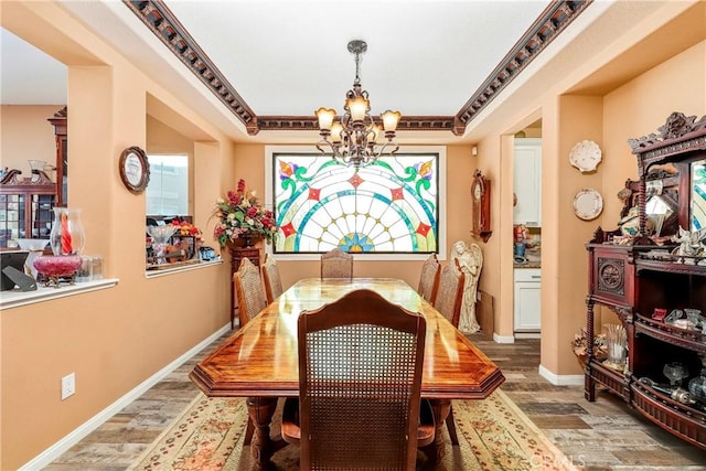 3565 Louer Dr, Lancaster, CA 93536 - dining area featuring an inviting chandelier, wood finished floors, and baseboards