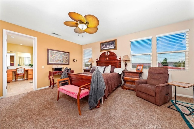 3565 Louer Dr, Lancaster, CA 93536 - bedroom with light colored carpet, visible vents, ceiling fan, and baseboards