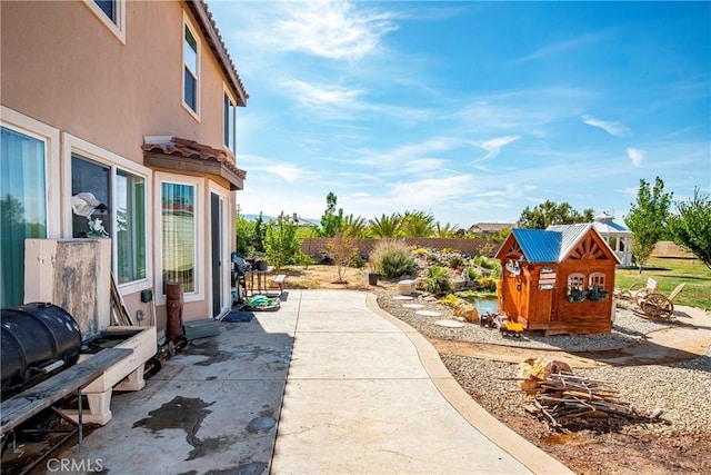 3565 Louer Dr, Lancaster, CA 93536 - view of yard featuring a fenced backyard and a patio area