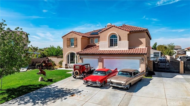 3565 Louer Dr, Lancaster, CA 93536 - mediterranean / spanish-style house featuring concrete driveway, a gate, a front yard, solar panels, and stucco siding