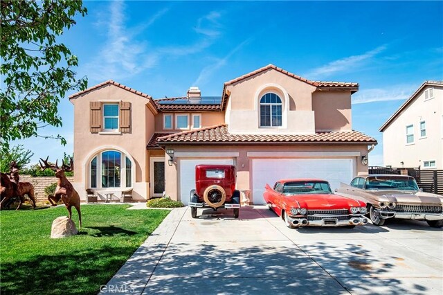 3565 Louer Dr, Lancaster, CA 93536 - mediterranean / spanish house with driveway, solar panels, stucco siding, a front lawn, and a garage