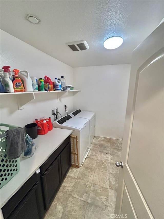6974 Canterra Way, Fontana, CA 92336 - laundry area featuring independent washer and dryer, a textured ceiling, and cabinet space