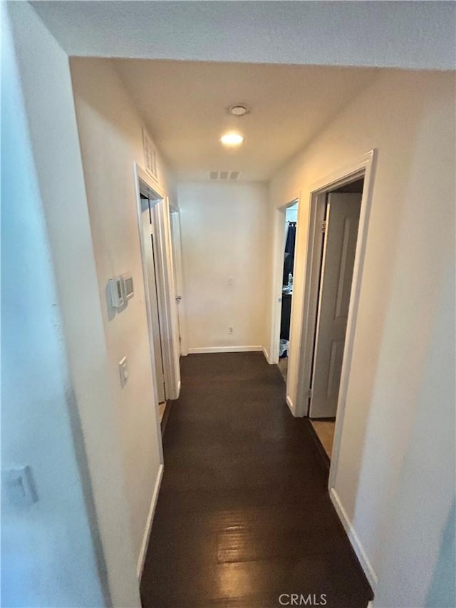 6974 Canterra Way, Fontana, CA 92336 - hallway featuring baseboards and dark wood-type flooring