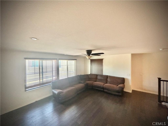 6974 Canterra Way, Fontana, CA 92336 - living area with ceiling fan and dark wood-style floors