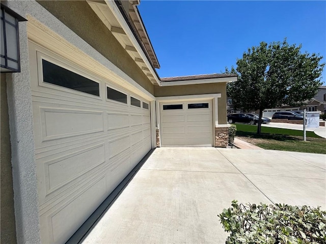 6974 Canterra Way, Fontana, CA 92336 - garage featuring driveway