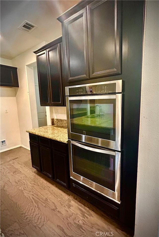 6974 Canterra Way, Fontana, CA 92336 - kitchen with double oven and light stone countertops
