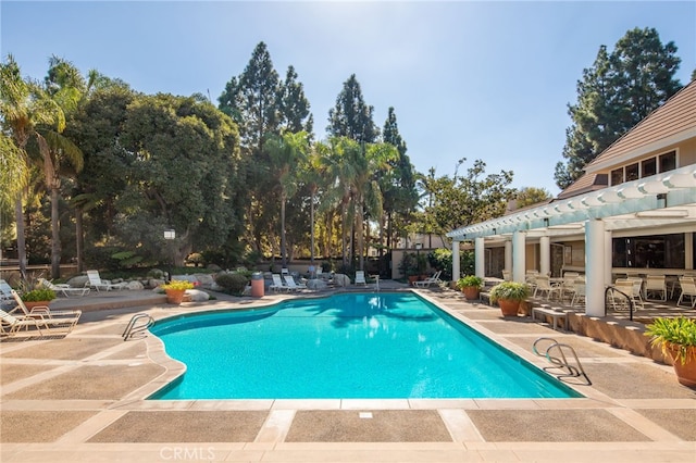 community pool with a patio