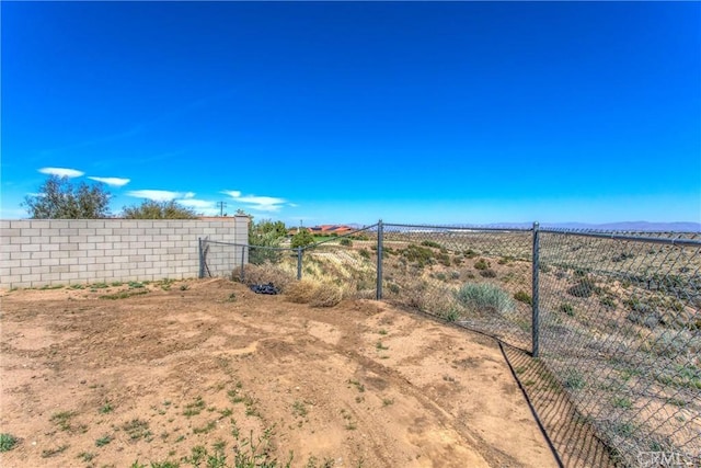 7045 Oak Hill Rd, Oak Hills, CA 92344 - view of yard featuring a mountain view and fence