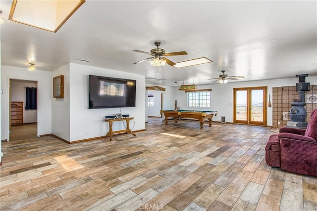 7045 Oak Hill Rd, Oak Hills, CA 92344 - interior space featuring light wood-style floors, baseboards, billiards, and a ceiling fan