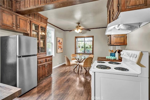 kitchen with freestanding refrigerator, under cabinet range hood, brown cabinets, white electric range, and ceiling fan