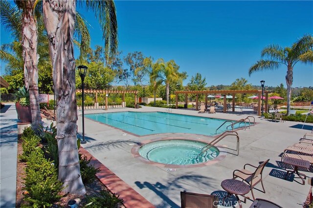 27695 Via Turina, Mission Viejo, CA 92692 - community pool featuring a hot tub, a patio, and a pergola