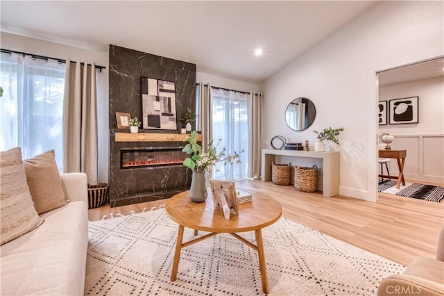 27695 Via Turina, Mission Viejo, CA 92692 - living room with recessed lighting, a large fireplace, wood finished floors, and lofted ceiling