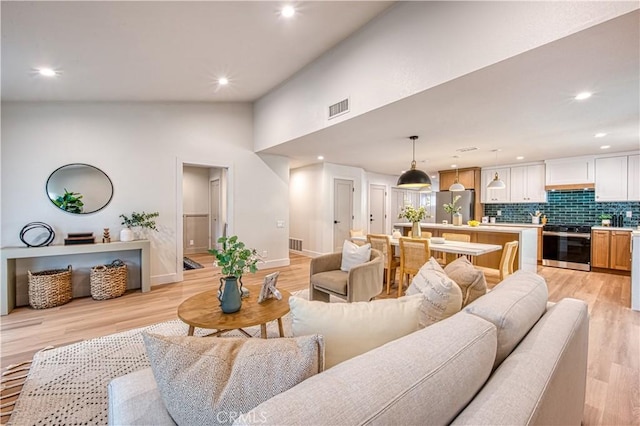 27695 Via Turina, Mission Viejo, CA 92692 - living area with light wood finished floors, baseboards, visible vents, and recessed lighting