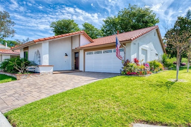 27695 Via Turina, Mission Viejo, CA 92692 - mediterranean / spanish-style house with a tile roof, a front lawn, driveway, a garage, and stucco siding