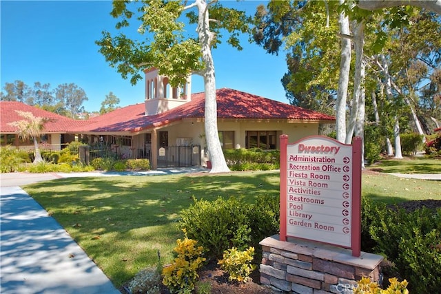 27695 Via Turina, Mission Viejo, CA 92692 - view of front of house with stucco siding, fence, a front lawn, and a gate