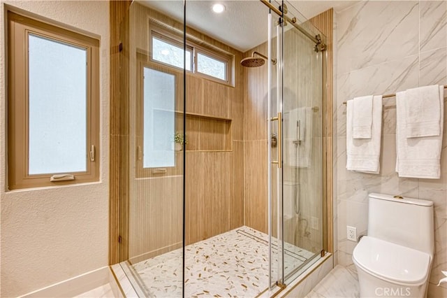 27695 Via Turina, Mission Viejo, CA 92692 - full bathroom featuring tile walls, toilet, and a stall shower