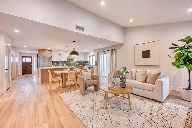 27695 Via Turina, Mission Viejo, CA 92692 - living area with light wood-type flooring, a wealth of natural light, visible vents, and recessed lighting