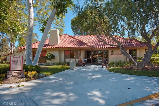 27695 Via Turina, Mission Viejo, CA 92692 - mediterranean / spanish house with a tile roof, a chimney, and stucco siding