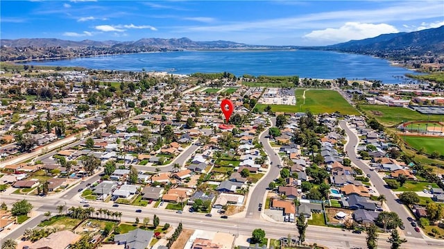 aerial view featuring a water and mountain view