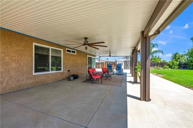 view of patio with a fenced backyard and ceiling fan