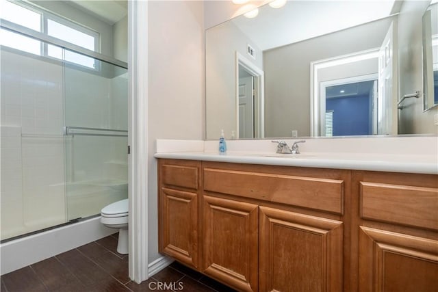 27321 Carlton Oaks St, Murrieta, CA 92562 - bathroom with toilet, visible vents, vanity, and a shower with door