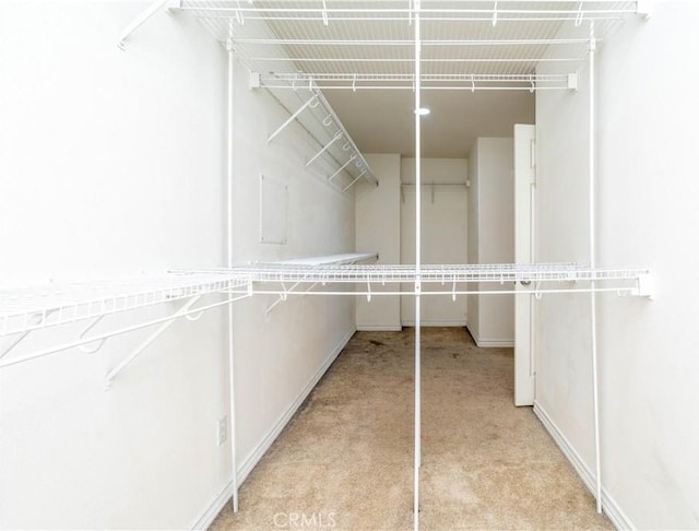 27321 Carlton Oaks St, Murrieta, CA 92562 - walk in closet featuring light colored carpet