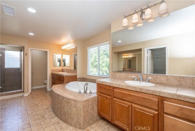 27321 Carlton Oaks St, Murrieta, CA 92562 - bathroom with a sink, visible vents, a stall shower, and a garden tub