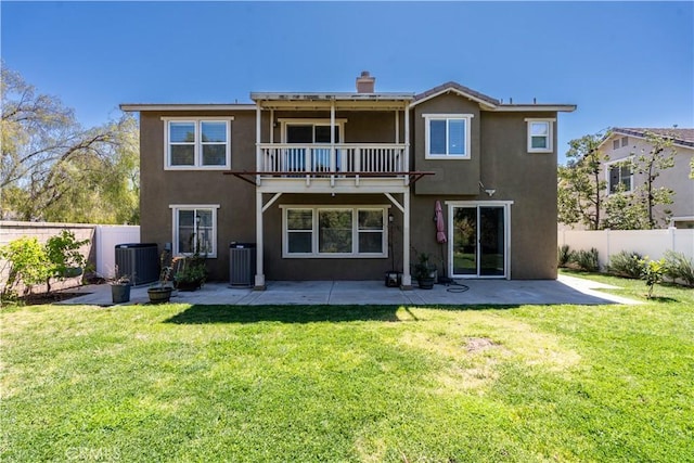 27321 Carlton Oaks St, Murrieta, CA 92562 - back of property with a balcony, stucco siding, central AC, and a lawn