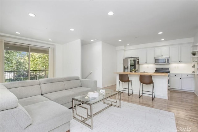 201 Native, Irvine, CA 92618 - living area featuring recessed lighting and light wood finished floors