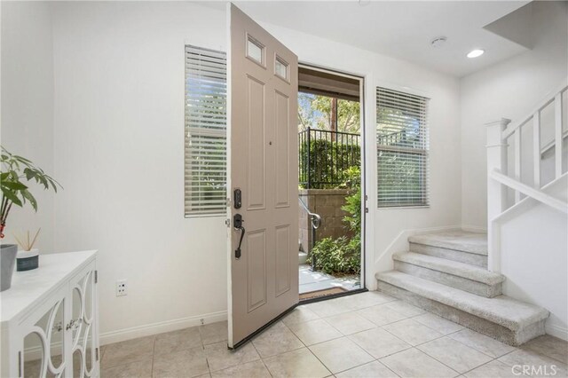 201 Native, Irvine, CA 92618 - entryway with stairs, light tile patterned floors, and recessed lighting