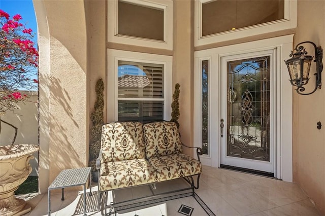 view of exterior entry with stucco siding