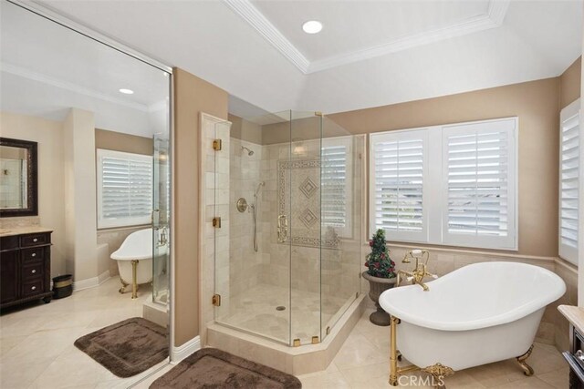 bathroom with a shower stall, a healthy amount of sunlight, and ornamental molding
