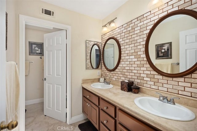 full bath featuring backsplash, a sink, visible vents, and double vanity