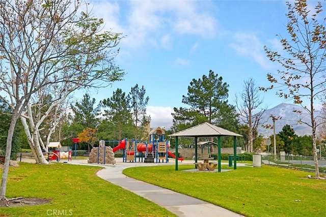 surrounding community featuring playground community and a yard