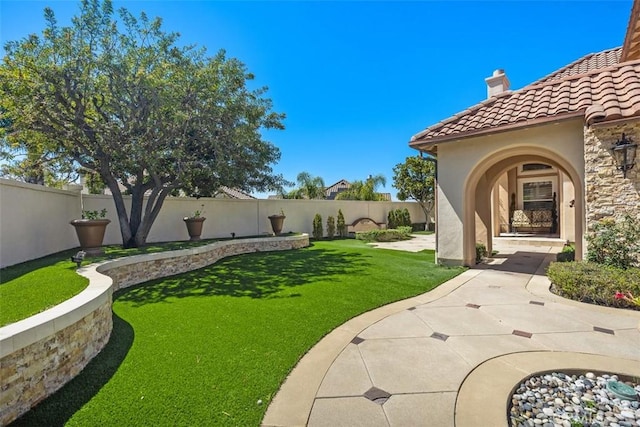 view of yard with a fenced backyard