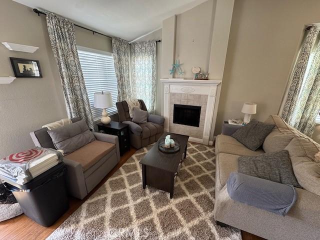 2 Via Pariente, Rancho Santa Margarita, CA 92688 - living room with lofted ceiling and a tiled fireplace