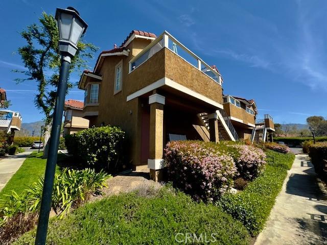 2 Via Pariente, Rancho Santa Margarita, CA 92688 - view of home's exterior with stairway and stucco siding