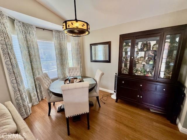 2 Via Pariente, Rancho Santa Margarita, CA 92688 - dining space with wood finished floors, lofted ceiling, and baseboards
