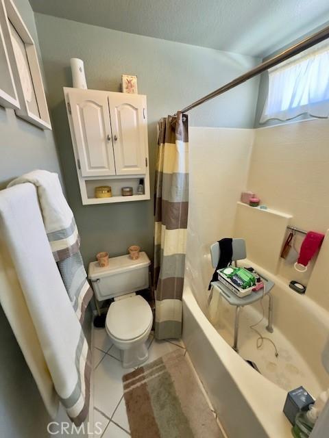 2 Via Pariente, Rancho Santa Margarita, CA 92688 - full bath featuring toilet, tile patterned flooring, and shower / tub combo with curtain